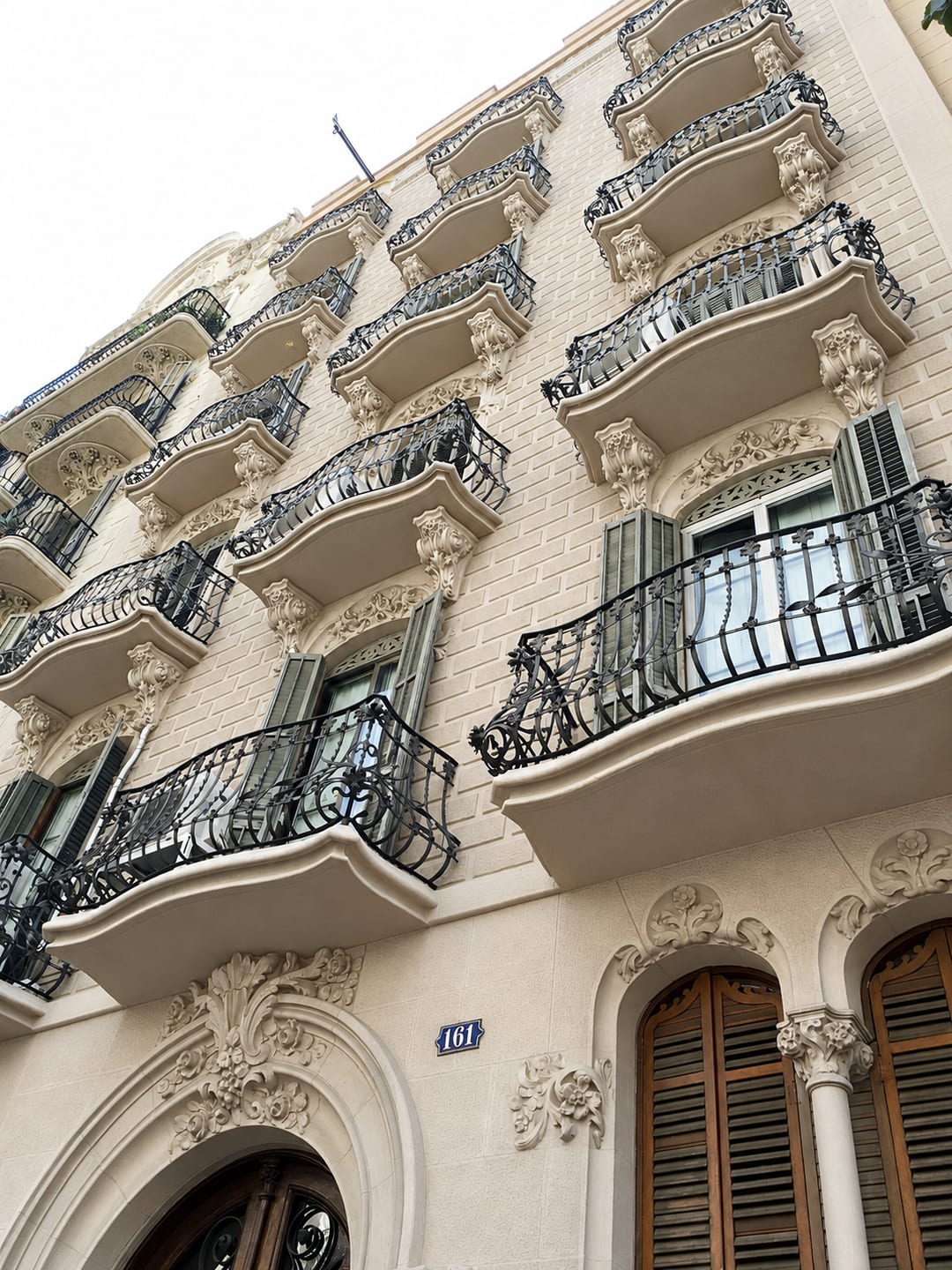 Wrought iron balconies on an Eixample facade at Carrer de Balmes 161, Barcelona